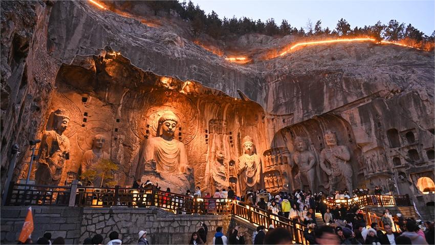Embark on a mesmerizing night tour of Longmen Grottoes, C China's Henan