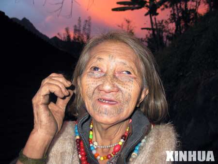 Lapei Nani of the Derung ethnic group shows her tattooed face in Drung-Nu 
