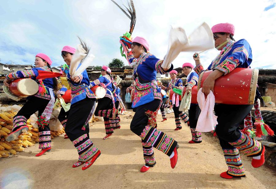 Women of Yi ethnic group dance to celebrate the opening of the 18th National Congress of the Communist Party of China (CPC), in Shuangbai County, southwest China's Yunnan Province, Nov. 8, 2012. The 18th CPC National Congress was opened in Beijing on Thursday. (Xinhua/Yang Zongyou)
