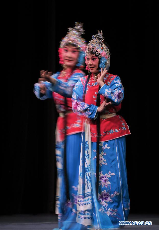 This multiple-exposure photo taken on Nov. 8, 2012 shows a Peking Opera performer from Taiwan performing Peking Opera "The Legend of the White Snake" during a rehearsal press conference in Taipei, southeast China's Taiwan. A three-day joint performance by Peking Opera performers from both Chinese mainland and Taiwan will be staged in Taiwan from Nov. 9 to 11. (Xinhua/Yin Bogu)