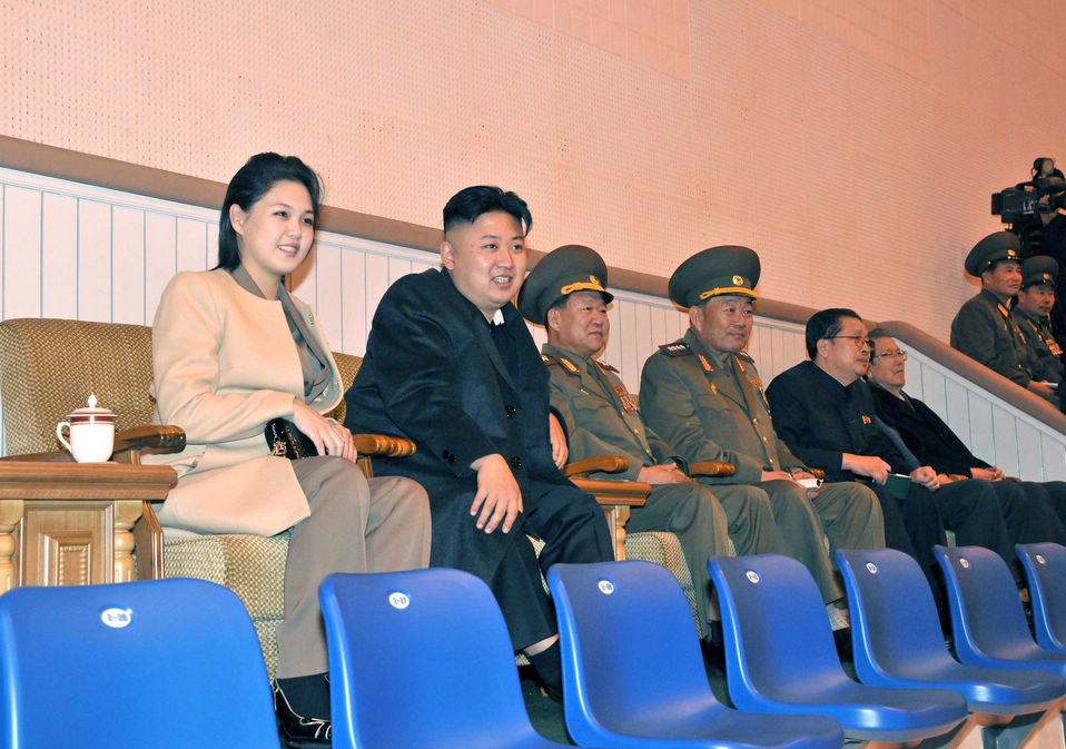 Kim Jong Un, top leader of the Democratic People's Republic of Korea (DPRK) and his wife Ri Sol Ju watch a women's volleyball match between the Pongae team and the Pyongyang team, according to the country's official news agency KCNA's report on Nov.7, 2012. (KCNA)