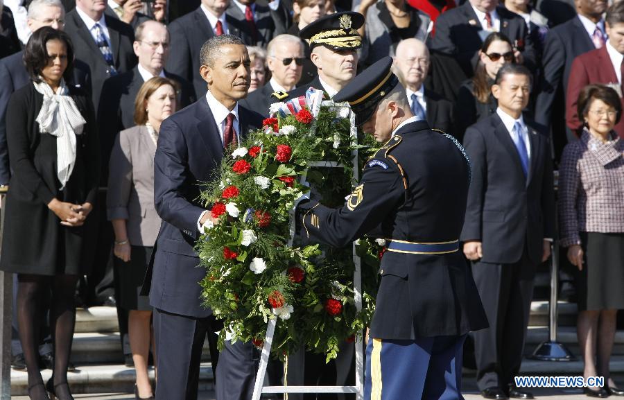 U.S. President Barack Obama takes part in a wreath laying ceremony in honor of the veterans in front of the Tomb of the Unknowns at Arlington National Cemetery outside Washington D.C., capital of the United States, Nov. 11, 2012. (Xinhua/Fang Zhe) 