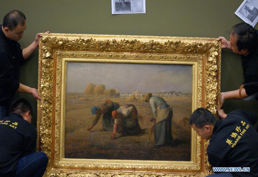Miller's masterpiece "Gleaners" is seen during the exhibition arrangement of "Millet, Courbet and French Naturalism: Masterpieces from Musee d'Orsay" at the China Art Meseum in east China's Shanghai, Nov. 12, 2012. A total of 87 masterpieces dating from the mid-19th century to the early 20th century by Millet, Courbet, Corot, Bonheur and etc. will be presented in the exhibition which is expected to be open on Nov. 16, 2012. (Xinhua/Ren Long) 