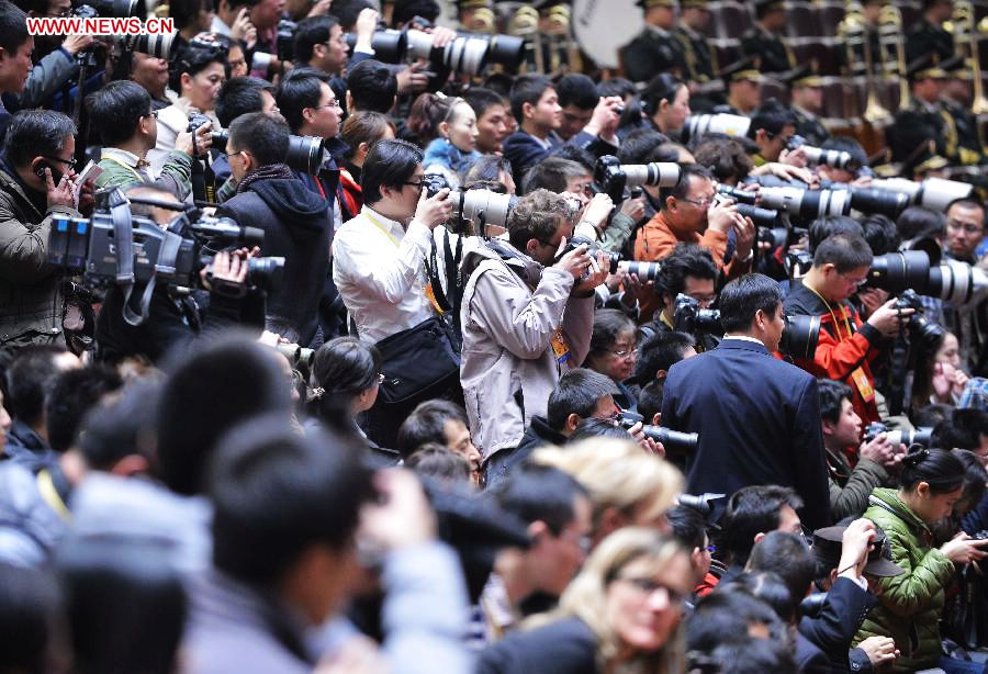 Journalists cover the closing session of the 18th National Congress of the Communist Party of China (CPC) at the Great Hall of the People in Beijing, capital of China, Nov. 14, 2012. (Xinhua/Li Xin)