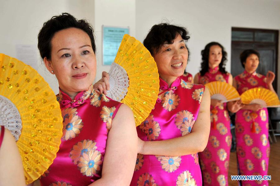 Members of an elder model team practise in Lanzhou, capital of northwest China's Gansu Province, Nov. 14, 2012. The elder model team that has 26 models with an average age of 62 is preparing for Gansu's 6th Elder Model Pageant that is to be held on Saturday. (Xinhua/Chen Bin) 
