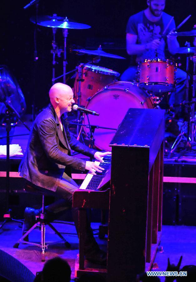 Isaac Slade, lead vocals and piano of American piano rock band "The Fray", performs during a concert at Tango Club in Beijing, capital of China, Nov. 14, 2012. The band was formed in 2002 and featured by the use of the piano as the lead instrument in their music. (Xinhua/Xiao Xiao)