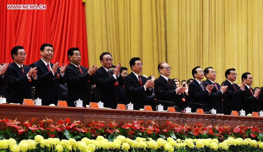 Hu Jintao (5th L), Jiang Zemin (5th R), Wu Bangguo (4th L), Wen Jiabao (4th R), Jia Qinglin (3rd L), Li Changchun (3rd R), Xi Jinping (2nd L), Li Keqiang (2nd R), He Guoqiang (1st L) and Zhou Yongkang (1st R) applaud during the closing session of the 18th National Congress of the Communist Party of China (CPC) at the Great Hall of the People in Beijing, capital of China, Nov. 14, 2012.(Xinhua/Pang Xinglei)