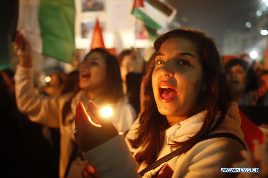 Palestinians take part in a rally against Israeli military operation in the Gaza Strip, in the West Bank city of Ramallah, on Nov. 19, 2012. (Xinhua/Fadi Arouri) 