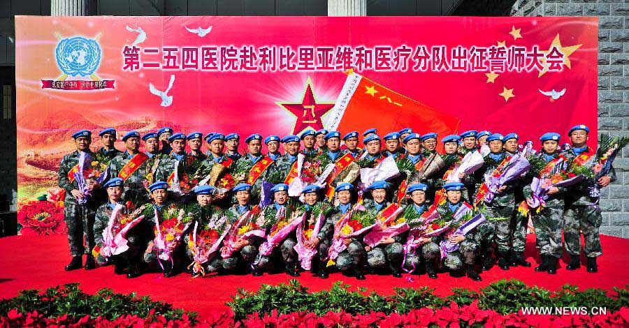 Members of the medical team of the 14th batch of Chinese peacekeeping force for Liberia pose for a group photo during a departure ceremony in Tianjin, north China, Nov. 13, 2012. The first batch of a 43-member Chinese medical personnel group left for Liberia on a eight-month UN peacekeeping mission here on Tuesday. (Xinhua/Zhang Chaoqun) 