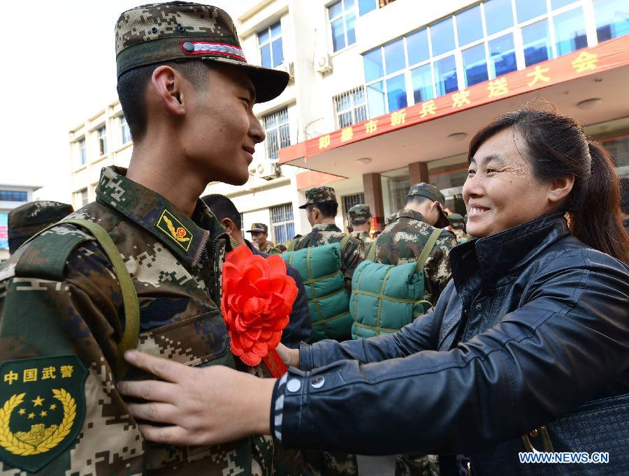 A mother sees her son off as the son is to leave for southwest China's Tibet Autonomous Region as a new soldier in Jimo City, east China's Shandong Province, Nov. 21, 2012. A total of 55 new soldiers in Jimo have headed to Tibet region ahead of schedule so as to adapt to plateau climate. (Xinhua/Ning Youpeng) 