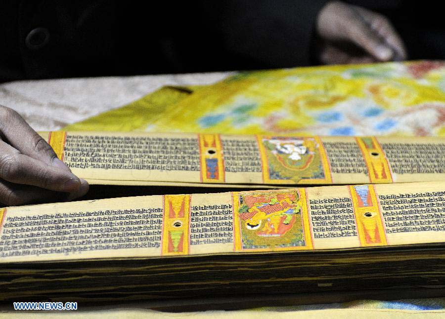 Photo taken on Nov. 21, 2012 shows the Palm-Leaf Manuscripts of Buddhist Sutras in Lhasa, capital of southwest China's Tibet Autonomous Region. The palm-leaf manuscripts of Buddhist sutras have been well preserved in China. Palm-Leaf sutras refer to the Buddhist classics inscribed on the leaves of palm trees. The practice originated in India and was introduced into China more than 1,000 years ago during the Tang Dynasty (618-907).(Xinhua/Chogo) 