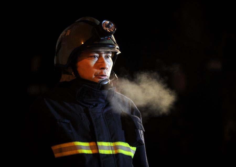 A fireman works at the explosion site in Shouyang County of Jinzhong City, north China's Shanxi Province, Nov. 24, 2012. An explosion at a restaurant on Friday evening killed at least eight people and injured another 37. An investigation is conducted to determine the cause of the explosion. (Xinhua/Yan Yan) 
