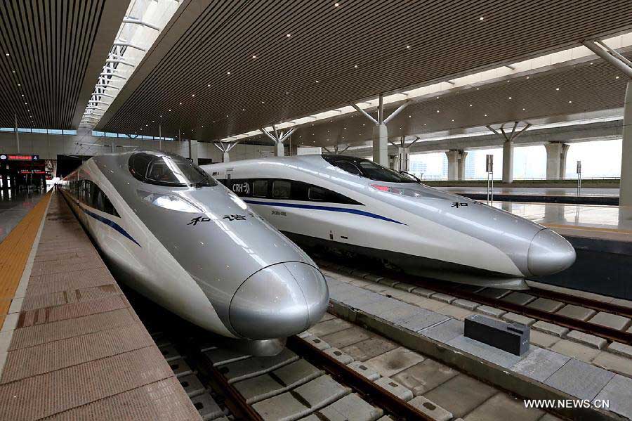 Trains wait to leave for Beijing at Zhengzhou East Railway Station in Zhengzhou City, capital of central China's Henan Province, Nov. 25, 2012. The high-speed rail route from Beijing to the southern Chinese city of Guangzhou will open next month, cutting the 2,200-km journey time by 14 hours, according to the Ministry of Railways. A trial operation along the Beijing-Zhengzhou section, the last part of the route, began on Sunday morning. (Xinhua/Qing Zhu)