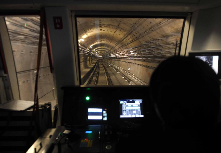 A test train runs on the northern section of Subway Line 9 in Beijing, capital of China, Nov. 26, 2012. The northern section of Beijing Subway Line 9, which operates between the National Library and Beijing West Station, is scheduled to open by the end of 2012. The southern section of the 16.45-km subway line is already in service since its opening on Dec. 31, 2011. (Xinhua/Gong Lei) 