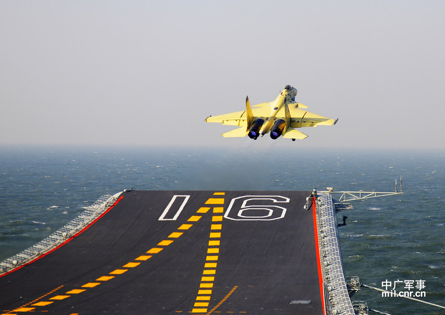 Photo shows carrier-borne J-15 fighter jet taking off from China's first aircraft carrier, the Liaoning. (mil. cnr.cn/ Sun Li)
