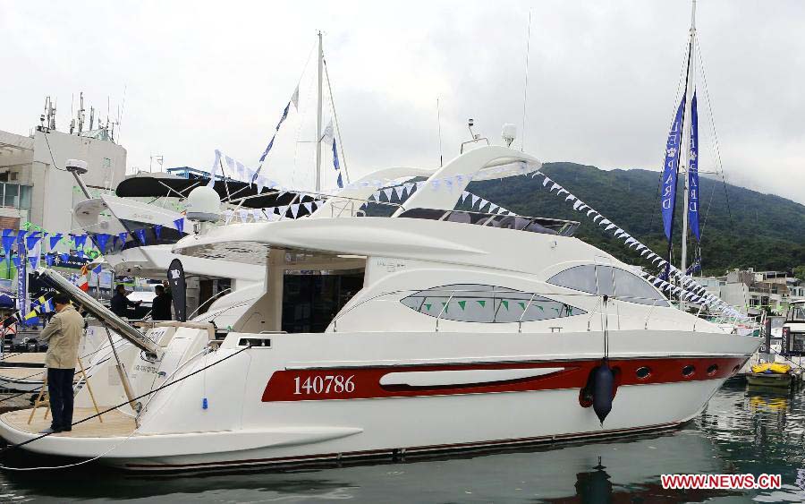 A yacht is pictured at its booth during Hong Kong International Boat Show 2012 in south China's Hong Kong, Dec. 2, 2012. The boat show closed on Sunday. (Xinhua/Li Peng) 