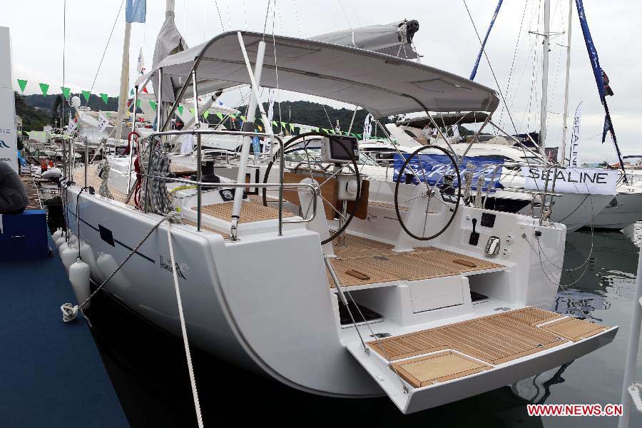 A yacht is pictured at its booth during Hong Kong International Boat Show 2012 in south China's Hong Kong, Dec. 2, 2012. The boat show closed on Sunday. (Xinhua/Li Peng) 