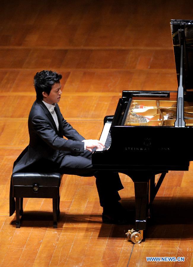 Chinese pianist Li Yundi gives performance at the National Centre for the Performing Arts (NCPA) in Beijing, capital of China, Dec. 1, 2012. (Xinhua/Luo Xiaoguang)