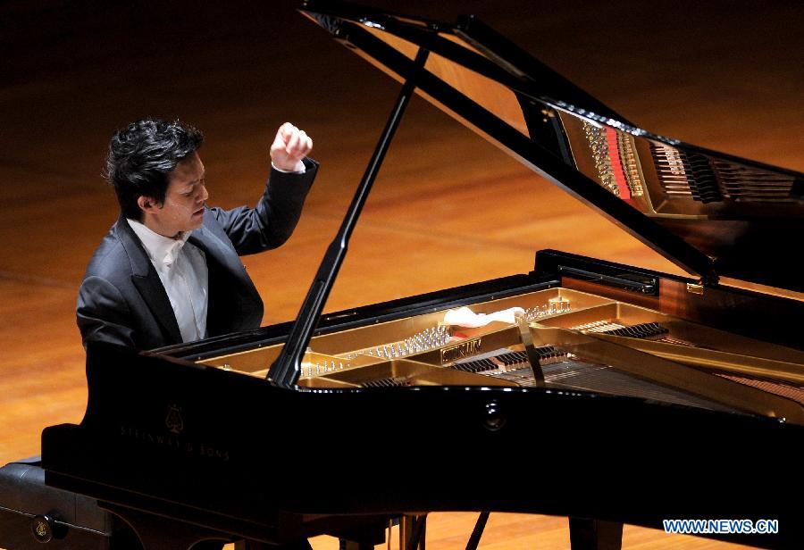 Chinese pianist Li Yundi gives performance at the National Centre for the Performing Arts (NCPA) in Beijing, capital of China, Dec. 1, 2012. (Xinhua/Luo Xiaoguang) 