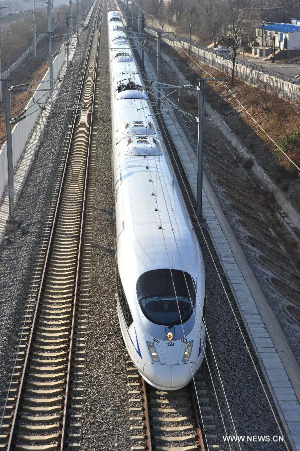 The D501 high-speed train leaves the Dalian North Railway Station in Dalian, northeast China's Liaoning Province, Dec. 1, 2012.  (Xinhua/Liu Debin)