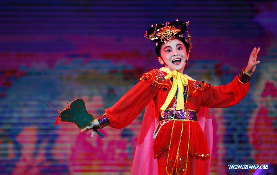 A student from Singapore performs during the awarding ceremony of a Chinese opera contest for students at the National Academy of Chinese Theatre Arts in Beijing, capital of China, Dec. 2, 2012. About 2,000 students participated in the contest. (Xinhua/Duan Zhuoli)