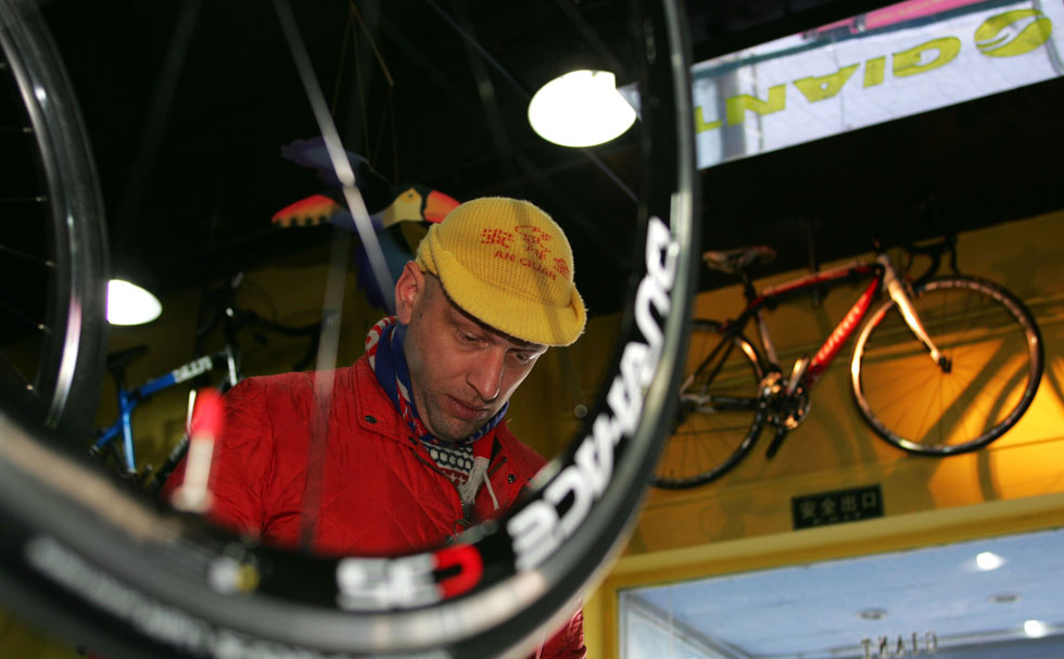 Johnson-Hill is seen in a bicycle store near Nanluoguxiang of Beijing, capital of China, March 6, 2012. 