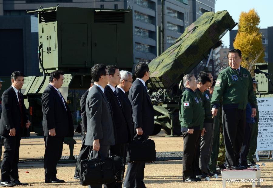 Japanese Prime Minister Yoshihiko Noda (1st R) inspects the PAC-3 (Patriot Advanced Capability-3) missile unit in Tokyo, Japan, Dec. 7, 2012. Japanese government has deployed PAC-3 missiles in Tokyo and Okinawa after the Democratic People's Republic of Korea (DPRK) announced their satellite launch plan. (Xinhua/Ma Ping)