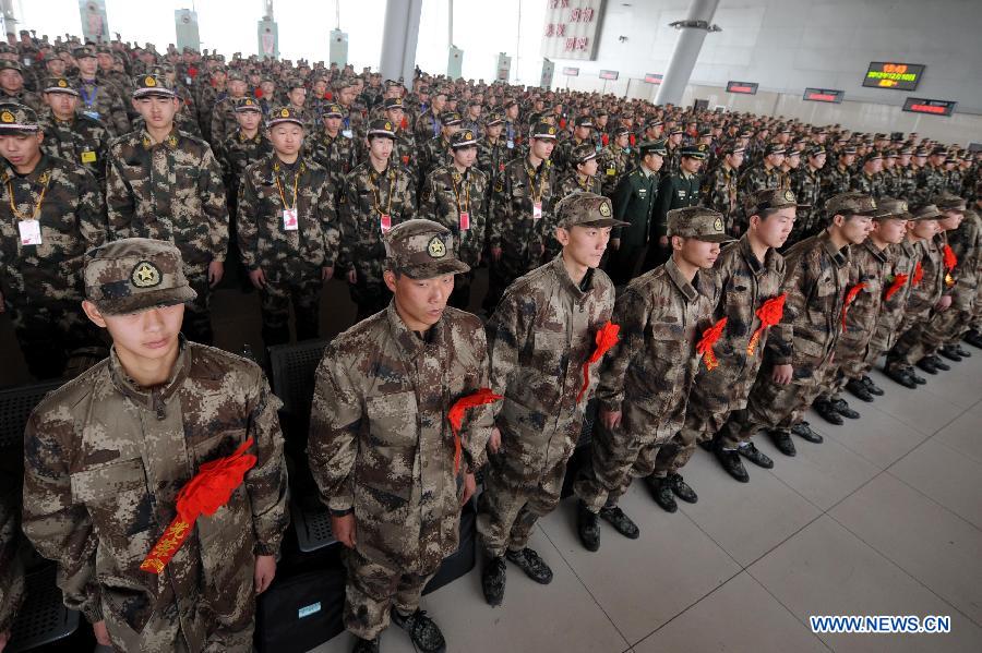Newly recruited soldiers of People's Liberation Army (PLA) attend a farewell ceremony before setting off at Nanjing Railway Station in Nanjing, capital of east China's Jiangsu Province, Dec. 10, 2012. A total of 545 new recruits from Nanjing, Nantong, Taizhou and Yancheng, four cities in Jiangsu, set off on Monday to join their army units. (Xinhua/Sun Can)