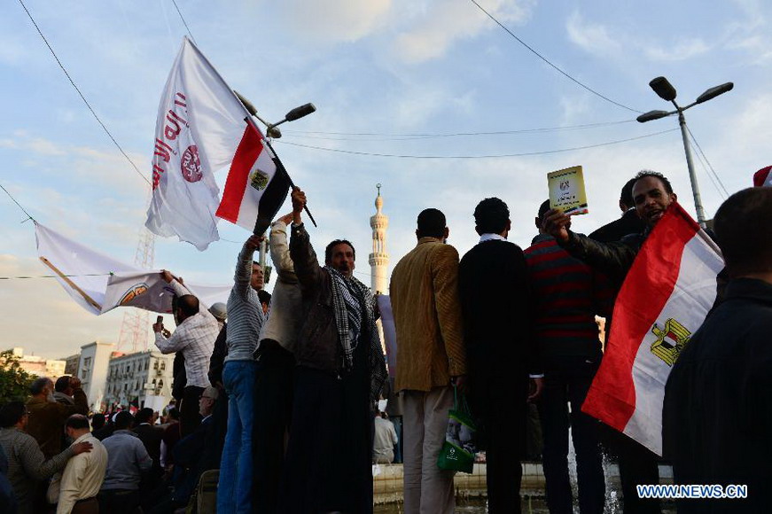 Supporters of Egyptian President Mohamed Morsi participate in a rally in Nasser city district in Cairo, Egypt, Dec. 11, 2012, four days ahead of a nationwide referendum on the new draft constitution. (Xinhua/Qin Haishi) 