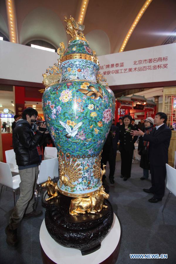 A cloisonne vase is displayed at the Beijing pavilion during the 2012 China Time-Honoured Brand Expo in Beijing, capital of China, Dec. 12, 2012. The five-day expo, opening Wednesday at the Beijing Exhibition Center, attracted some 160 Chinese time-honoured brand exhibitors. (Xinhua) 