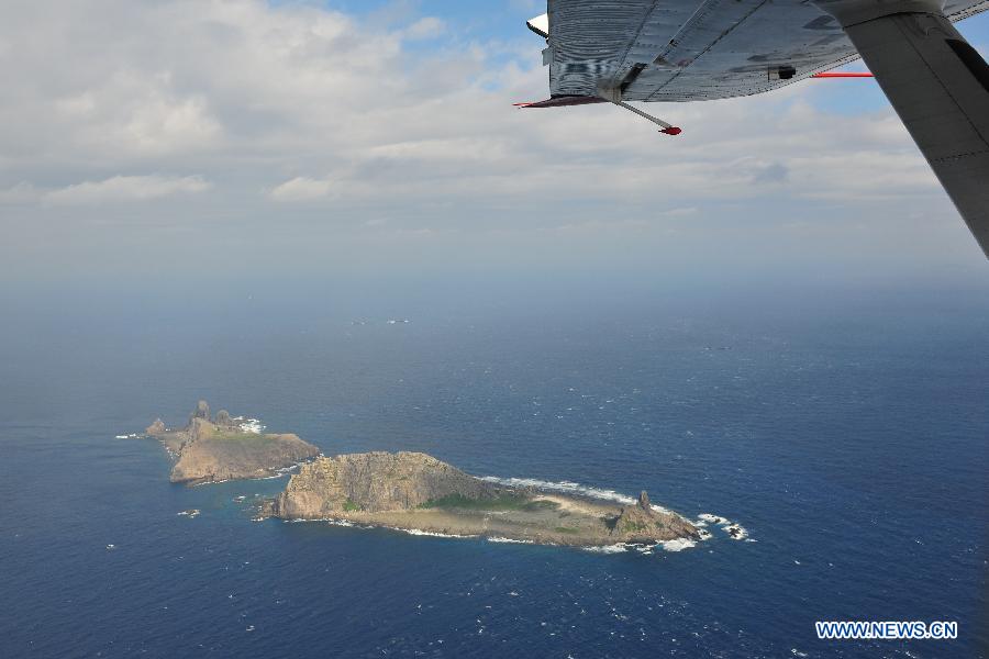 Photo taken on a marine surveillance plane B-3837 on Dec. 13, 2012 shows the Diaoyu Islands and nearby islands. A Chinese marine surveillance plane was sent to join vessels patrolling the territorial waters around the Diaoyu Islands on Thursday morning, according to China's maritime authorities. (Xinhua)
