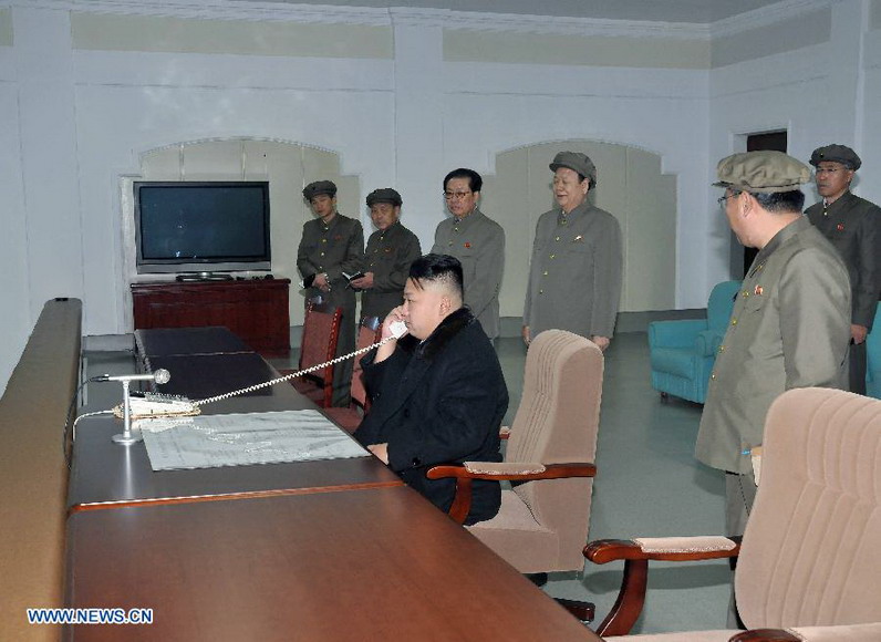 This photo provided by KCNA on Dec. 14, 2012 shows Kim Jong Un (C), top leader of the Democratic People's Republic of Korea (DPRK), gives the launch order of Kwangmyongsong-3 satellite at the Pyongyang General Satellite Control Command Center on Dec. 12, 2012. (Xinhua/KCNA)