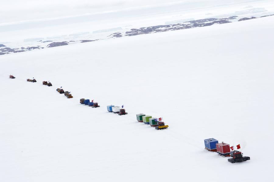 A squad team of Chinese Antarctic exploration team drives in Antarctic on Dec. 16, 2012, before leaving for China's Kunlun station. The journey is the country's 29th scientific expedition to Antarctica. A significant part of the mission will also include looking for a location for the country's fourth station in the region and second-phase construction of the Kunlun Station. (Xinhua/Xu Wei)