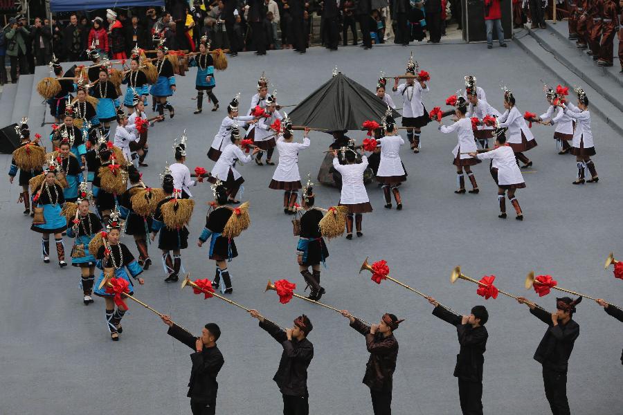 People celebrate the Sama Festival in the Sanbao Dong Village in Rongjiang County, southwest China's Guizhou Province, Dec. 18, 2012. The Sama Festival, an ancient traditional festival commemorating the woman ancestors of Dong ethnic group, was listed as one of China's state intangible cultural heritages in 2006. The festival of this year will last till Dec. 20. (Xinhua/Peng Nian) 