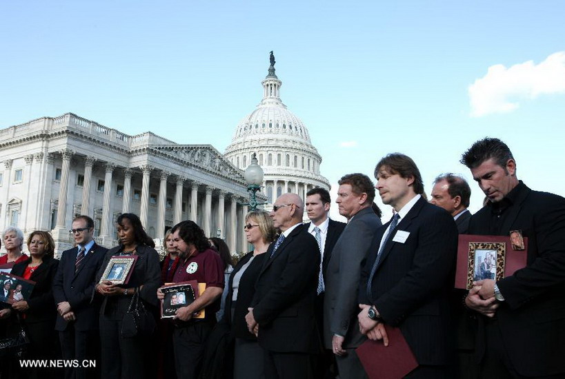 Family members who have lost their beloved ones and survivors of mass shootings gather in front of the Capitol Hill in Washington D.C. on Dec. 18, 2012. Families of victims share with the media a letter signed by families who have lost beloved ones in all of the recent mass shootings across the country. The letter will be delivered to the White House and Members of Congress. (Xinhua/Fang Zhe) 