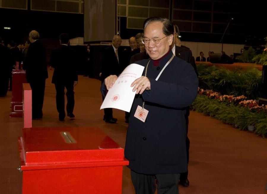 Member of the presidium Donald Tsang Yam-kuen votes at the Conference for Electing Deputies of the Hong Kong Special Administrative Region (HKSAR) to the 12th National People's Congress (NPC) in Hong Kong, south China, Dec. 19, 2012.(Xinhua/Lui Siu Wai)
