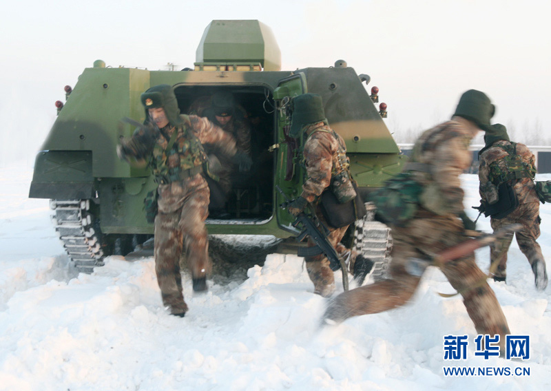 An armored regiment under the Shenyang Military Area Command of the Chinese People's Liberation Army (PLA) took its troops to unfamiliar area on December 16, 2012 to conduct drill on such subjects as rapid maneuvering and coordination of infantrymen and tanks, in a bid to temper its troops in an all-round way. (Xinhua/Xu Zhilin)