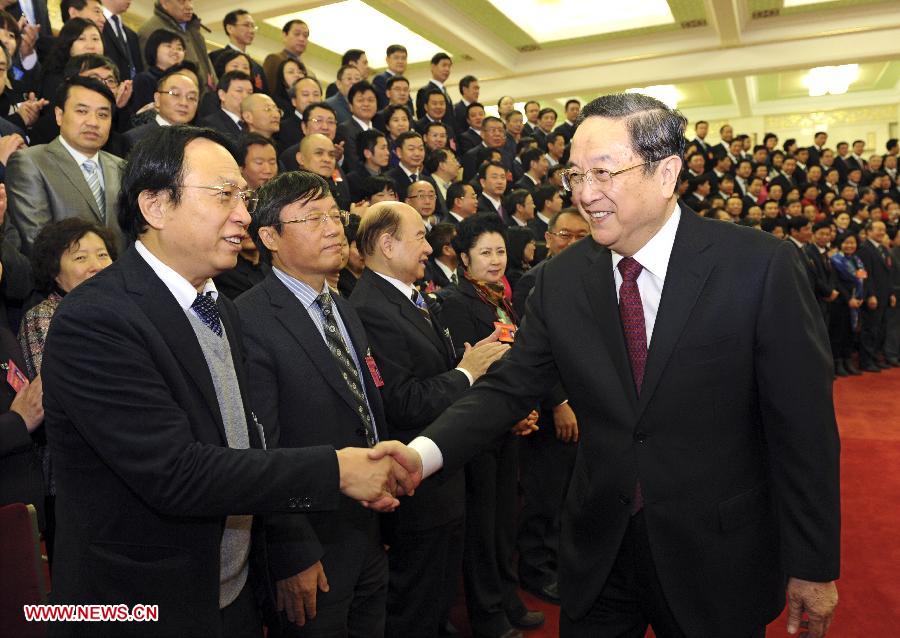 File photo taken on Dec. 6, 2012 shows Yu Zhengsheng (R, front) meets with delegates to the 15th National Congress of the Chinese Peasants and Workers Democratic Party (CPWDP) in Beijing, capital of China. (Xinhua/Rao Aimin) 