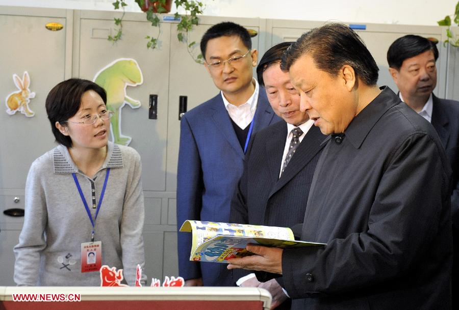 In this file photo taken on March 22, 2009, Liu Yunshan (R, front), then a member of the Political Bureau of the Communist Party of China (CPC) Central Committee, also a member of the Secretariat of the CPC Central Committee and head of the Publicity Department of the CPC Central Committee, learns about the operating status of publishers after restructuring during an investigation and research tour at the Shandong Publishing Group. (Xinhua/Zhu Zheng) 