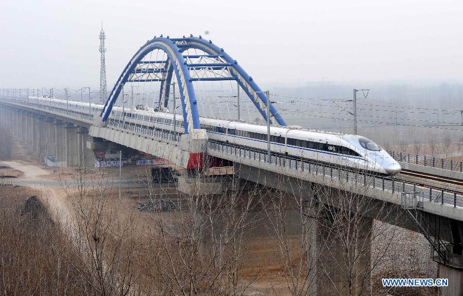 High-speed train G90 leaves Zhengzhou, capital of central China's Henan Province, for Beijing, capital of China, Dec. 26, 2012. Zhengzhou is one of the 35 stops of the 2,298-kilometer Beijing-Guangzhou High-speed Railway, the world's longest, which was put into operation on Wednesday. (Xinhu/Zhu Xiang)