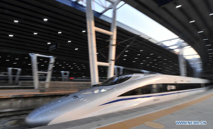 Bullet train G801 leaves the Beijing West Railway Station in Beijing, capital of China, for Guangzhou, capital of south China's Guangdong Province, Dec. 26, 2012. (Xinhua/Li Wen) 