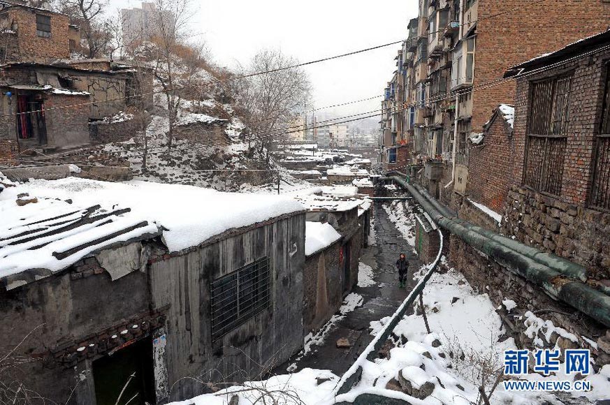 A slum area in No. 2 coal mine, Yangquan city, Shanxi province. Yangquan city is one of the most important coal energy bases in China. Since 2006, Yangmei Group has started modification and dumping works in this area to make it a better place. (Xinhua/ Fan Minda)