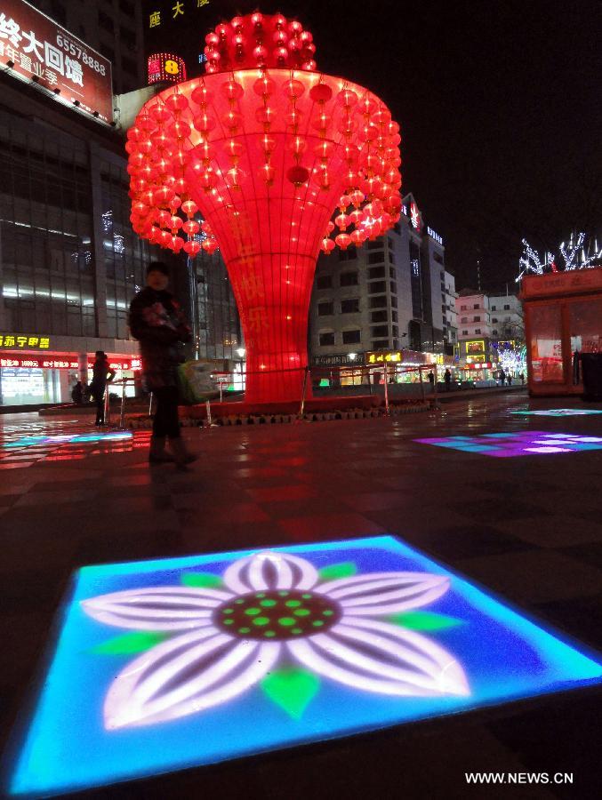 Photo taken on Jan. 9, 2013 shows a huge colored lantern at a square in Suzhou, east China's Jiangsu Province. Various colored lanterns were decorated in Suzhou to greet the upcoming Spring Festival, which falls on Feb. 10 this year. (Xinhua/Wang Jiankang)