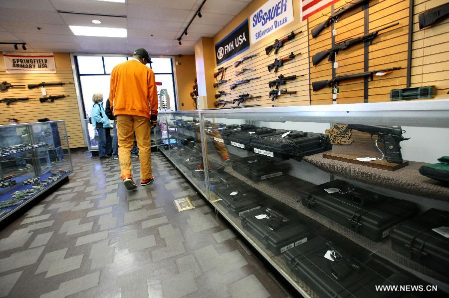 People look around at a gun shop in Chantilly, Virginia, the United States, on Jan. 10, 2013. U.S. Vice President Joe Biden said on Thursday he will present proposals of the White House gun-control task force to President Barack Obama by next Tuesday. (Xinhua/Fang Zhe) 