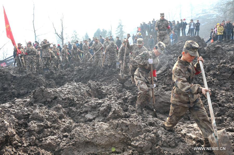 Rescuers leave a landslide spot in Zhenxiong mountain of Zhaotong City, southwest China's Yunnan Province, Jan. 12, 2012. The rescue of a landslide which hit the Zhaojiagou area of Gaopo Village early Friday finished after all 46 bodies were retrieved Saturday. (Xinhua/Chen Haining)    