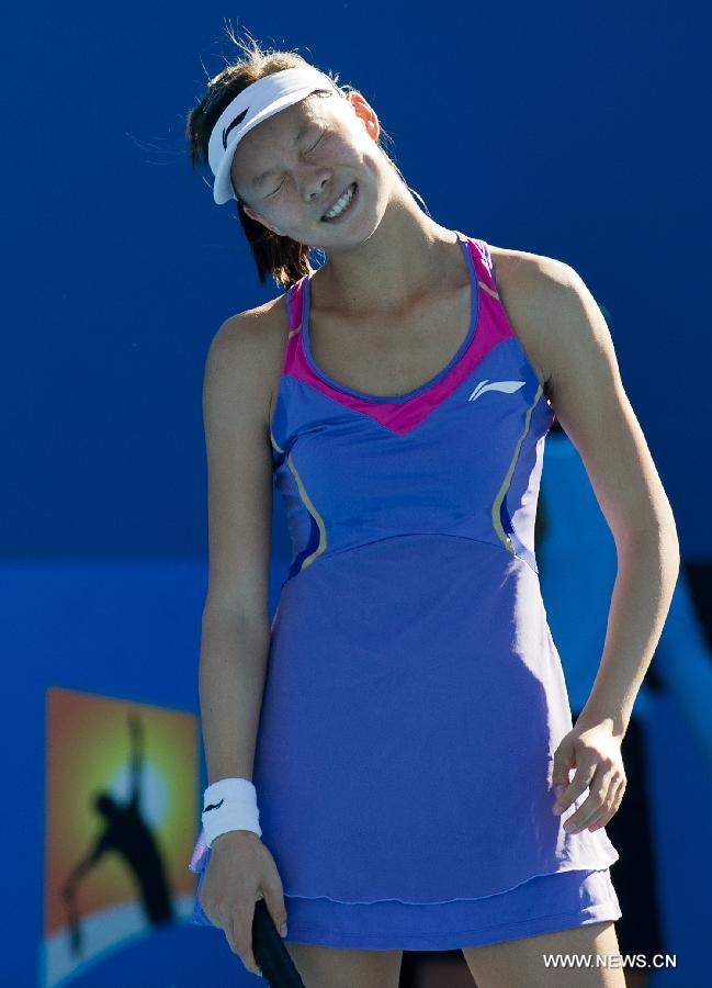 Zhang Yuxuan of China reacts during her first round women's singles match against Zheng Jie of China on the first day of 2013 Australian Open tennis tournament in Melbourne, Australia, Jan. 14, 2013. Zheng Jie won 2-1. (Xinhua/Bai Xue) 