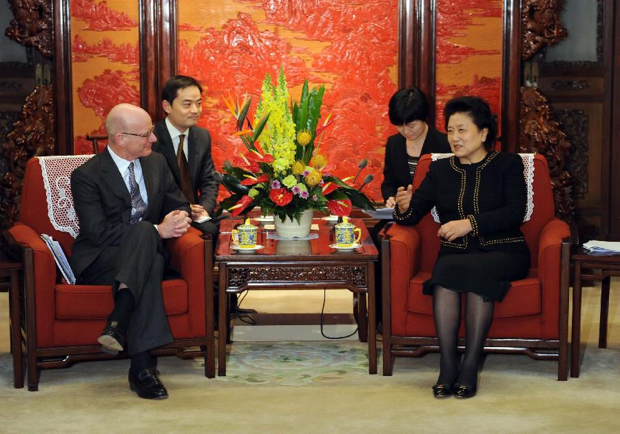 Chinese State Councilor Liu Yandong (R) meets with James Hughes-Hallett, chairman of the Swire Group, in Beijing, capital of China, Jan. 14, 2013. (Xinhua/Zhang Duo)
