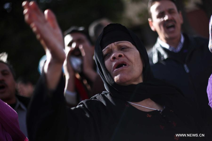 Anti-Morsi protesters shout slogans against the constitution in front of the Supreme Constitutional Court (SCC) in Cairo, Egypt, Jan. 15, 2013. Egyptian Supreme Constitutional Court is set to review Tuesday lawsuits against the Shura Council (upper house of the parliament) which currently assumes legislative power, as well as the dissolved Constituent Assembly which wrote the recently approved constitution. (Xinhua/Amru Salahuddien)