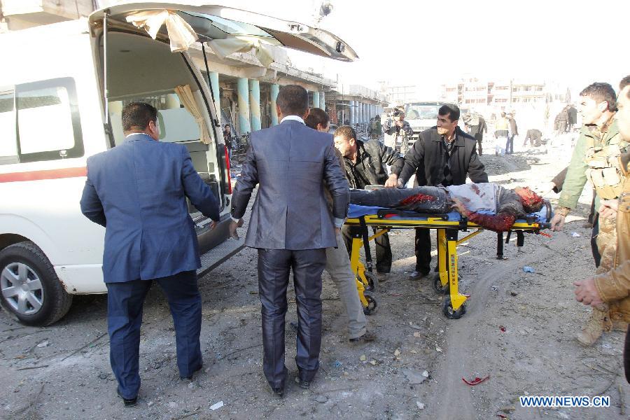 A victim is transported to hospital at the site of a bomb attack in Kirkuk, Iraq, on Jan. 16, 2013. Up to 17 people were killed and 133 wounded in two bomb attacks targeting offices of Kurdish parties in the ethnically mixed cities of Kirkuk and Tuz-Khurmato in northern Iraq on Wednesday, according to the police. (Xinhua/Dina Assad)