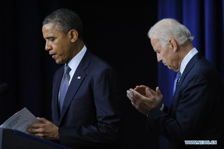 U.S. President Barack Obama and Vice President Joe Biden attend an event on gun violence reduction proposals at the White House in Washington D.C., capital of the United States, Jan. 16, 2013. Obama on Wednesday unveiled a sweeping and expansive package of gun violence reduction proposals, a month after the Sandy Hook Elementary School mass shooting killed 26 people including 20 schoolchildren. (Xinhua/Zhang Jun)